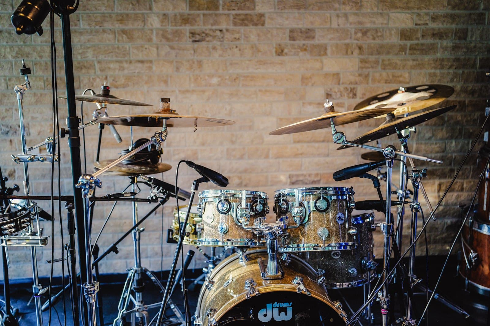 The drum room kit against the stone wall