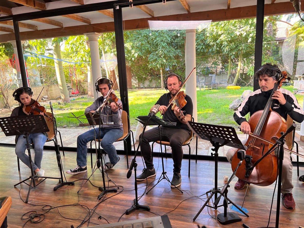 A string quartet recording with the garden beyond the windows