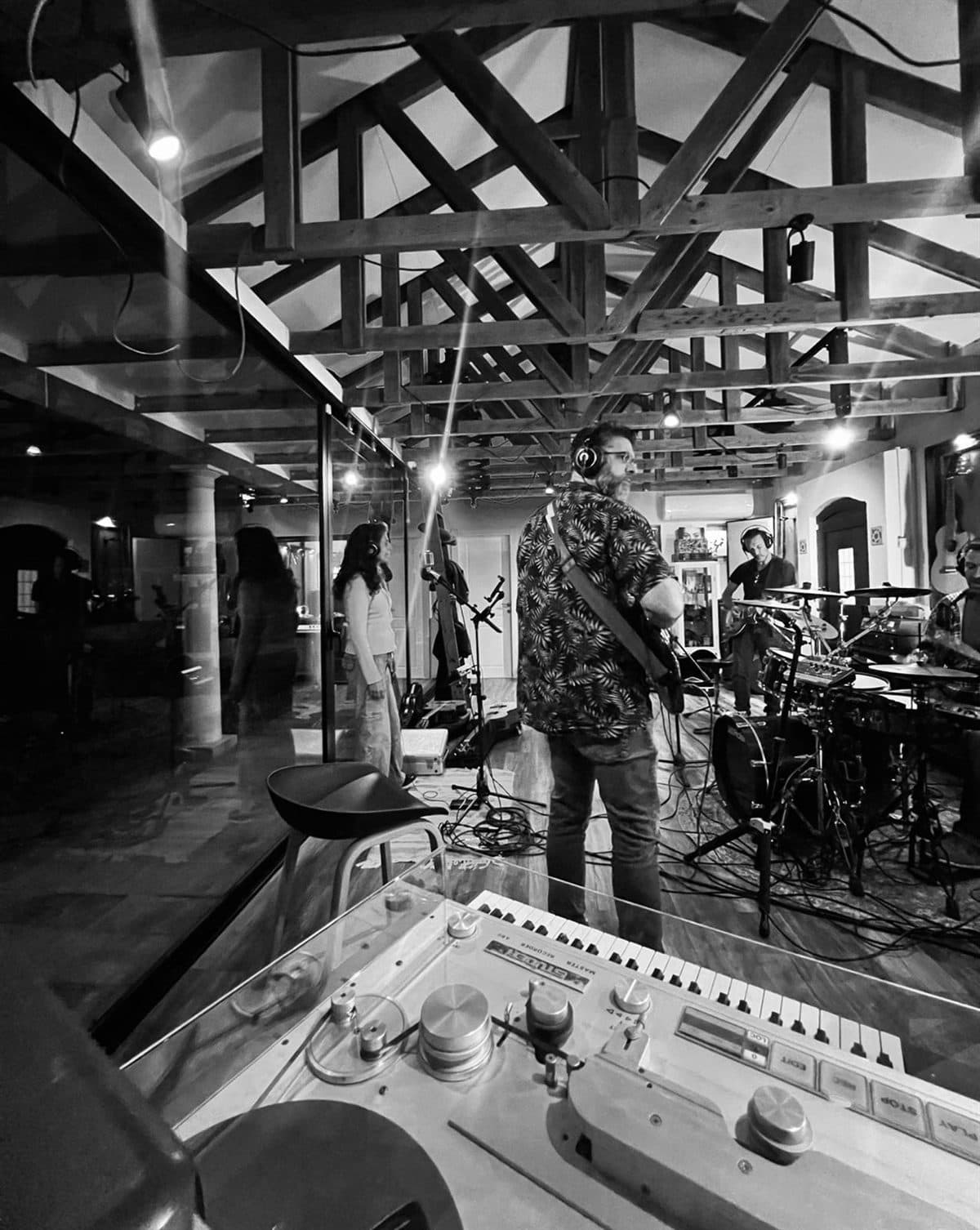 The live room under the wood trusses, mid-session